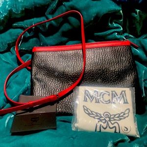 Brand new McM pouch long strap cross body style never worn tag still attached